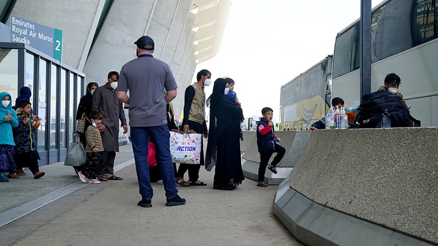 Afghan refugees displaced from their homes due to the Taliban takeover arrive at Washington Dulles International Airport in Chantilly, Va., on Monday, August 30, 2021.