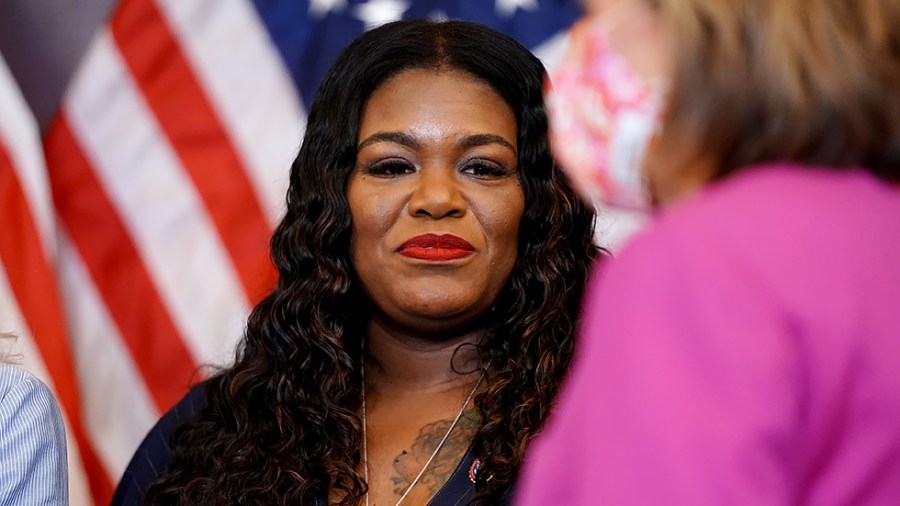 Rep. Cori Bush (D-Mo.) listens to Speaker Nancy Pelosi (D-Calif.) prior to an enrollment ceremony for the VOCA Fix to Sustain the Crime Victims Fund Act on Wednesday, July 21, 2021.