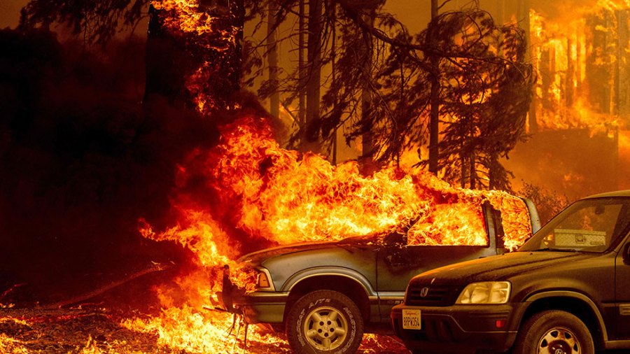 Cars burn in the Dixie Fire in California.