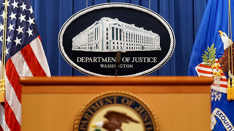 The Department of Justice logo is seen at their headquarters in Washington, D.C., on Thursday, August 5, 2021 prior to a press conference regarding a civil rights matter. 