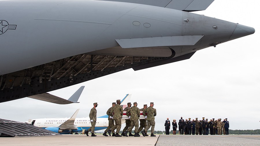 President Biden and other officials attend the dignified transfer of the remains of fallen service members at Dover Air Force Base in Dover, Del., on Aug. 29 after 13 members of the US military were killed in Afghanistan last week.