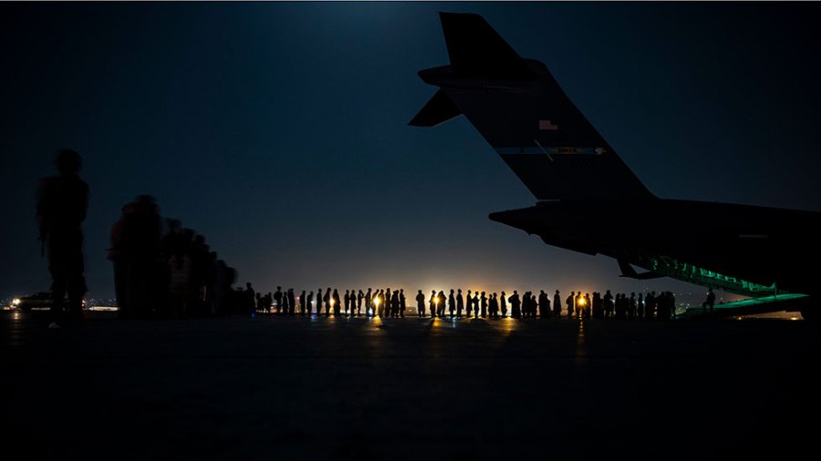 Afghan refugees wait in line to be evacuated from Kabul.