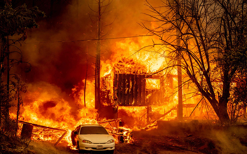 A home is consumed by flames