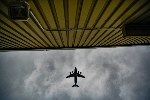  A plane flies over temporary camp for refugees from Afghanistan