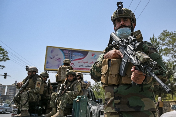 Taliban Fateh fighters, a "special forces" unit, stand guard on a street in Kabul