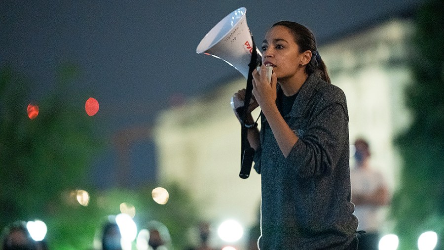 Rep. Alexandria Ocasio-Cortez (D-N.Y.) speaks to supporters outside the House Chamber on Saturday, July 31, 2021 as progressive House Democrats are demanding the House return to work on the expiring federal eviction moratorium which ends Aug 1.