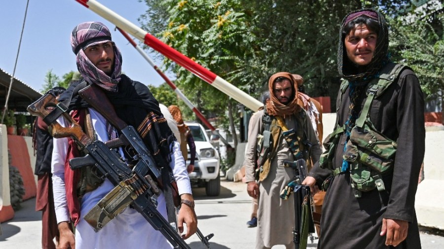 Taliban fighters guard a checkpoint in Kabul