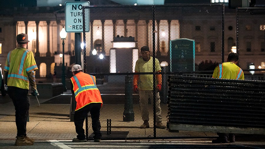 Workers install a fence around the U.S. Capitol in Washington, D.C., on Wednesday, September 15, 2021 prior to this weekend’s ‘Justice for J6 Rally’ for those arrested or killed during the Jan. 6 insurrection.