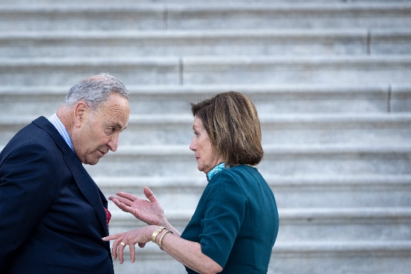 Senate Majority Leader Chuck Schumer (D-NY) talks with Speaker of the House Nancy Pelosi (D-CA)