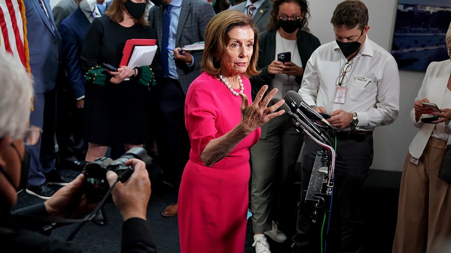 Speaker Nancy Pelosi (D-Calif.) speaks to reporters after a closed-door Democratic caucus meeting on Tuesday, September 28, 2021.