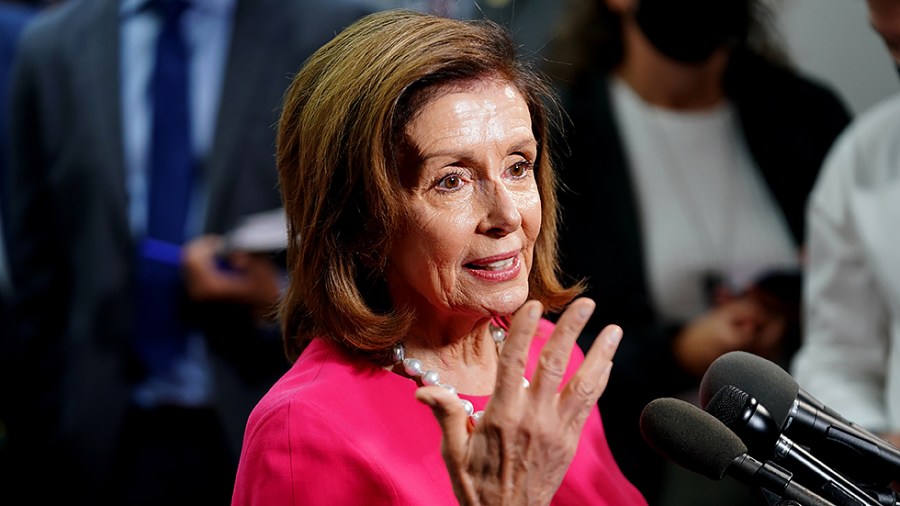 Speaker Nancy Pelosi (D-Calif.) speaks to reporters after a closed-door Democratic caucus meeting on Tuesday, September 28, 2021.