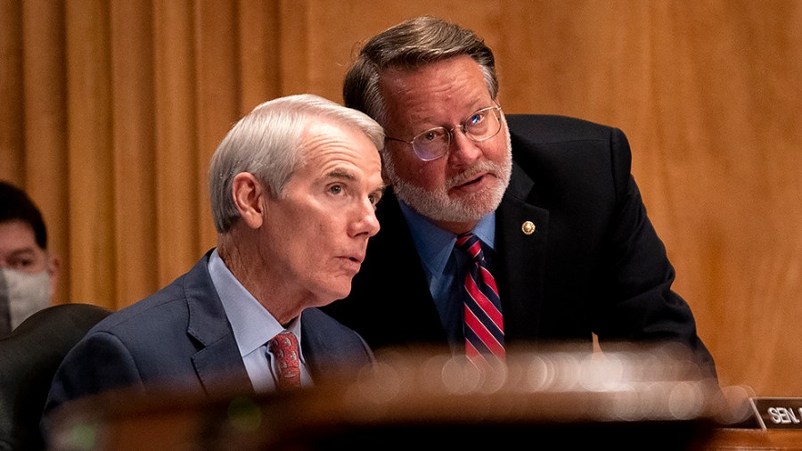 Sen. Rob Portman (R-Ohio) speaks to Sen. Gary Peters (D-Mich.) during a Senate Homeland Security & Governmental Affairs Committee hearing to discuss security threats 20 years after the 9/11 terrorist attacks on Tuesday, September 21, 2021.