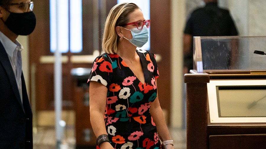 Sen. Kirsten Sinema (D-Ariz.) arrives to the Capitol for a series of nomination votes on Wednesday, September 22, 2021.