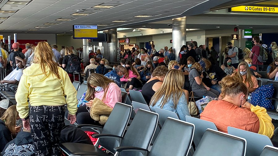 Passengers ares seen waiting in Terminal B for flight out of BWI Airport in Baltimore, Md., on Monday, August 16, 2021.