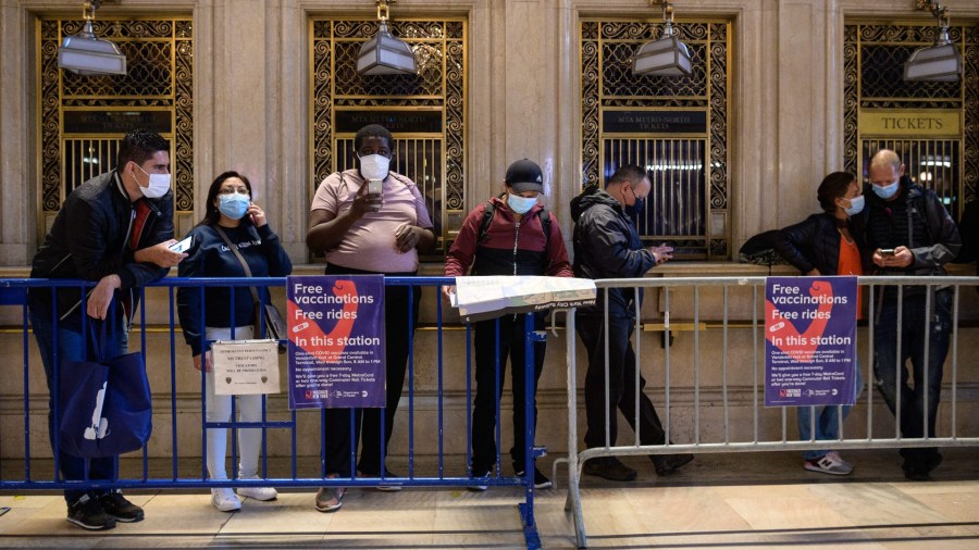 People wait in line for the COVID-19 vaccine