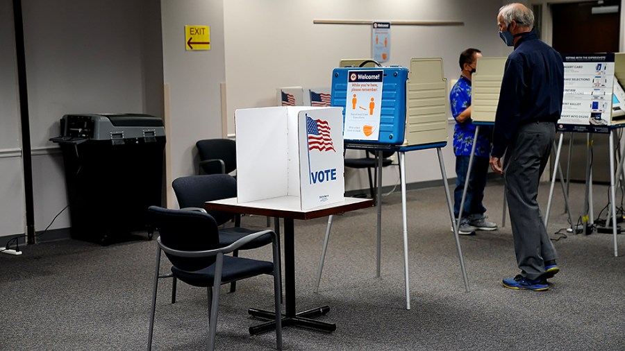 A voting booth is seen at an early voting polling site at the Fairfax County Government Center in Fairfax, Va., on Friday, September 17, 2021.