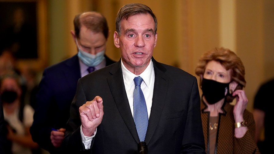 Sen. Mark Warner (D-Va.) addresses reporters after the weekly policy luncheon on Tuesday, September 21, 2021.