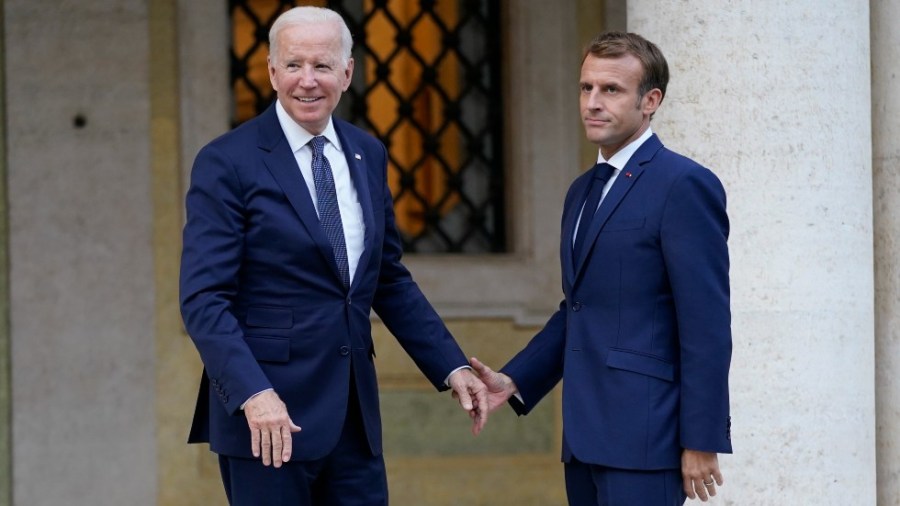 President Biden and French President Emmanuel Macron speak prior to a meeting at La Villa Bonaparte in Rome