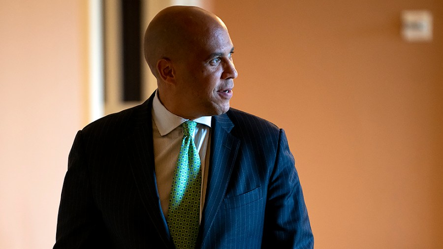 Sen. Cory Booker (D-N.J.) leaves a Senate Democratic luncheon on Thursday, October 7, 2021.