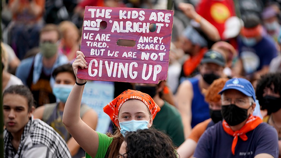 Climate protesters stage a sit-in outside the U.S. Capitol on Friday, October 15, 2021. The group ‘People vs Fossil Fuels’ want President Biden to end fossil fuel projects and to declare climate change a national emergency.