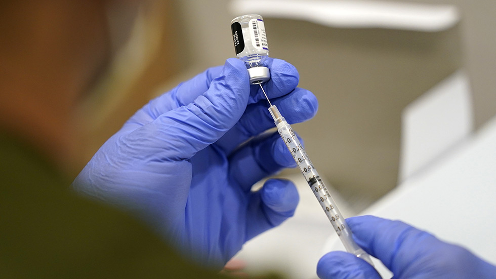 Coronavirus vaccine getting put into arm