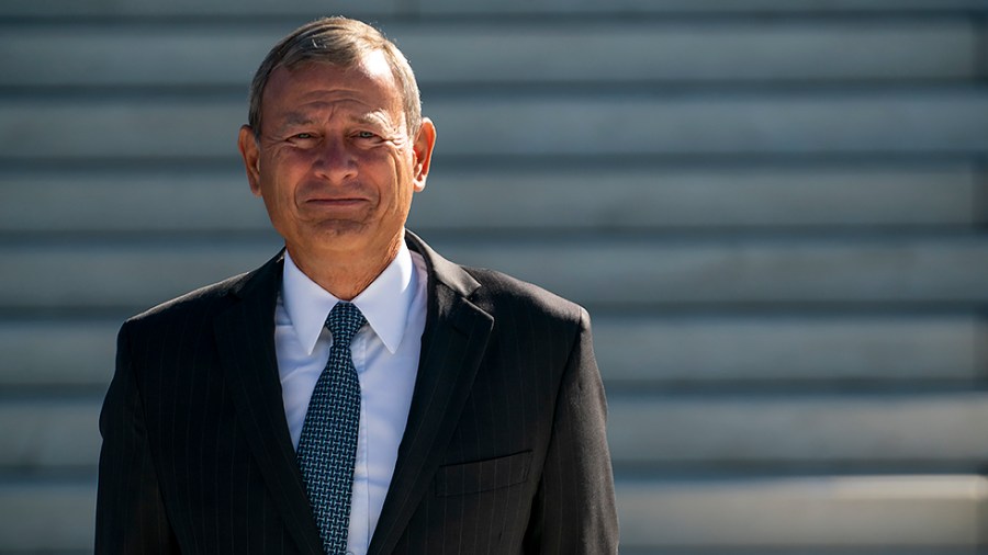 Chief Justice John Roberts is seen during a photo op with Supreme Court Justice Amy Coney Barrett after Barrett’s investiture ceremony at the Supreme Court in Washington, D.C., on Friday, October 1, 2021.