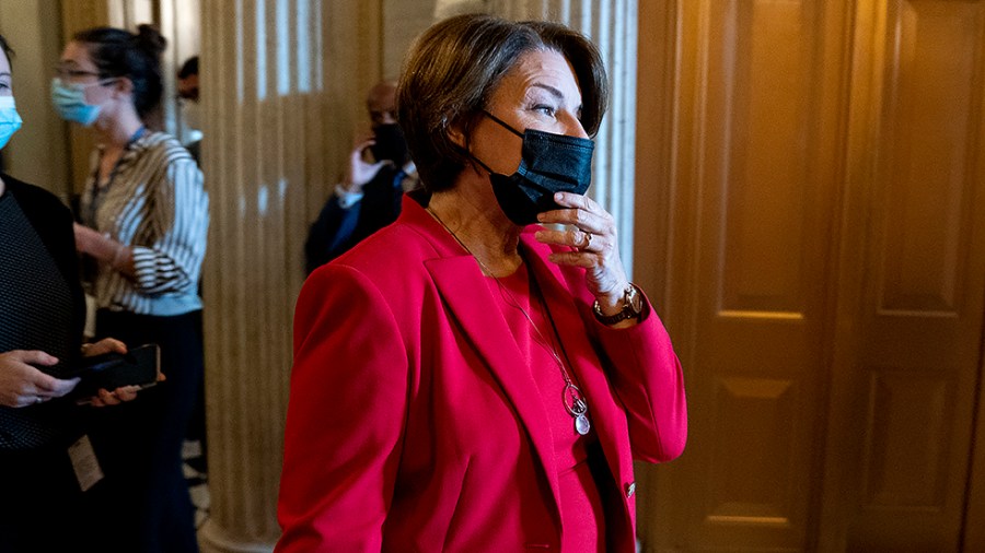 Sen. Amy Klobuchar (D-Minn.) leaves the Senate Chamber for a nomination vote on Tuesday, October 5, 2021.