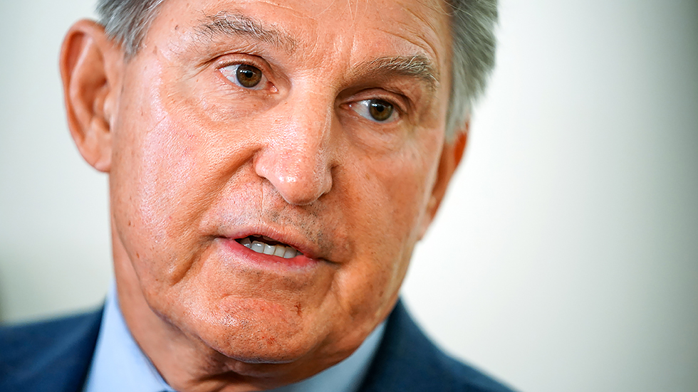 Sen. Joe Manchin (D-W.Va.) speaks to reporters prior to a Senate Energy and Natural Resources Committee hearing on Tuesday, October 5, 2021.