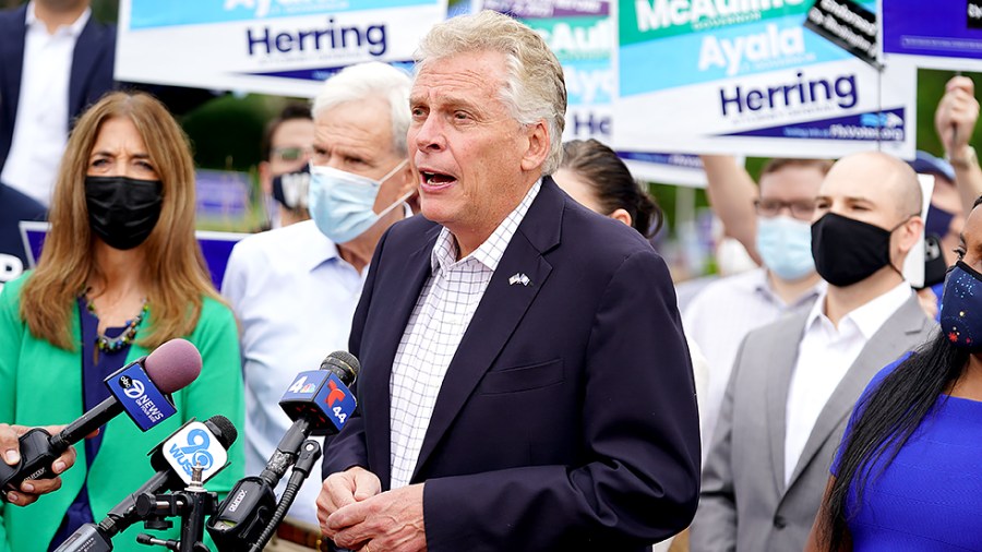 Virginia Democratic gubernatorial candidate Terry McAuliffe campaigns outside the Fairfax County Government Center in Fairfax, Va., as the state opens the polls for the first day of early voting on Friday, September 17, 2021.