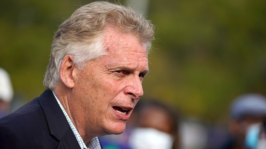 Virginia Democratic gubernatorial candidate Terry McAuliffe addresses reporters after casting his ballot during early voting at the Fairfax County Government Center in Fairfax, Va., on Wednesday, October 13, 2021.