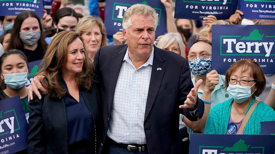 Virginia Democratic gubernatorial candidate Terry McAuliffe films a social media post prior to casting his ballot during early voting at the Fairfax County Government Center in Fairfax, Va., on Wednesday, October 13, 2021.