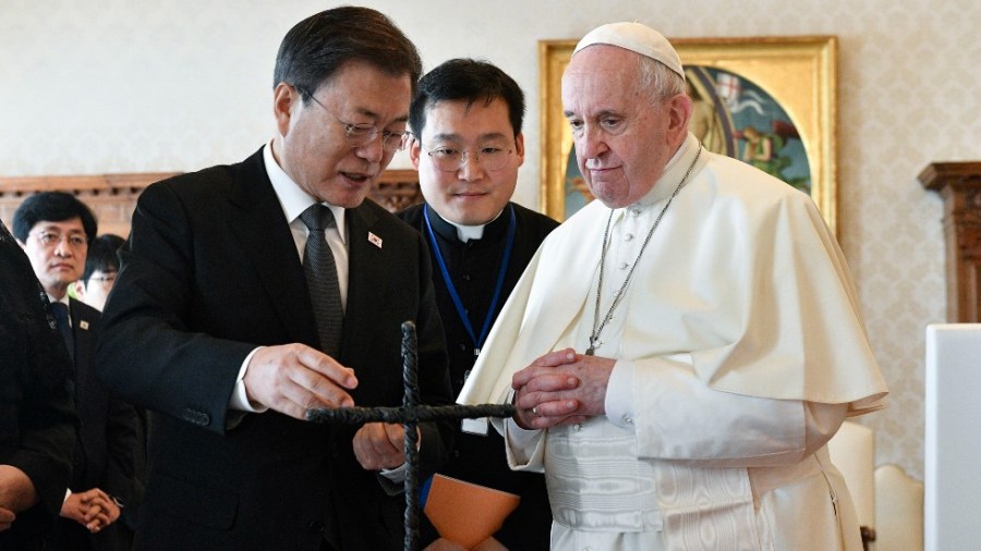 South Korean President Moon Jae-in exchanges gifts with Pope Francis as they meet at the Vatican