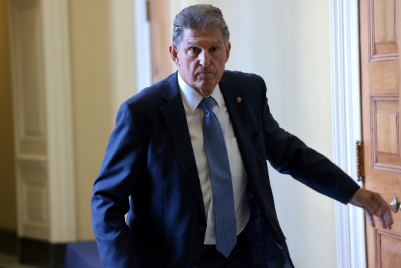 Sen. Joe Manchin (D-WV) leaves a Democratic luncheon at the U.S. Capitol