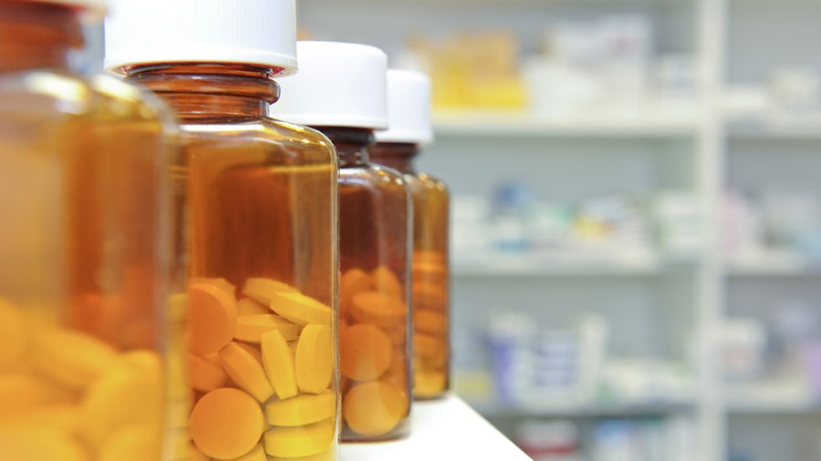 Pill bottles stacked next to each other