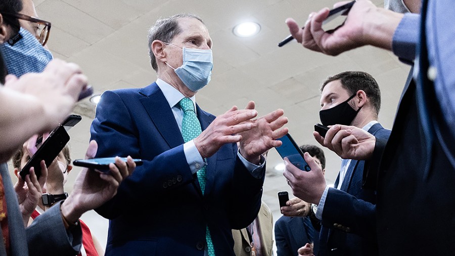 Sen. Ron Wyden (D-Ore.)speaks with reporters in the Capitol on Wednesday, September 29, 2021.