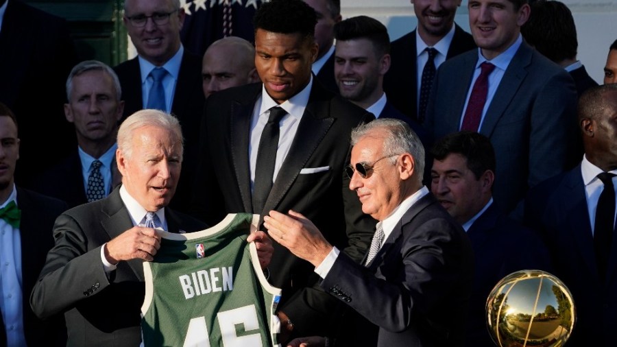 President Biden is presented a jersey presented by Milwaukee Bucks owner Marc Lasry during a White House event to celebrate the team's 2021 NBA championship