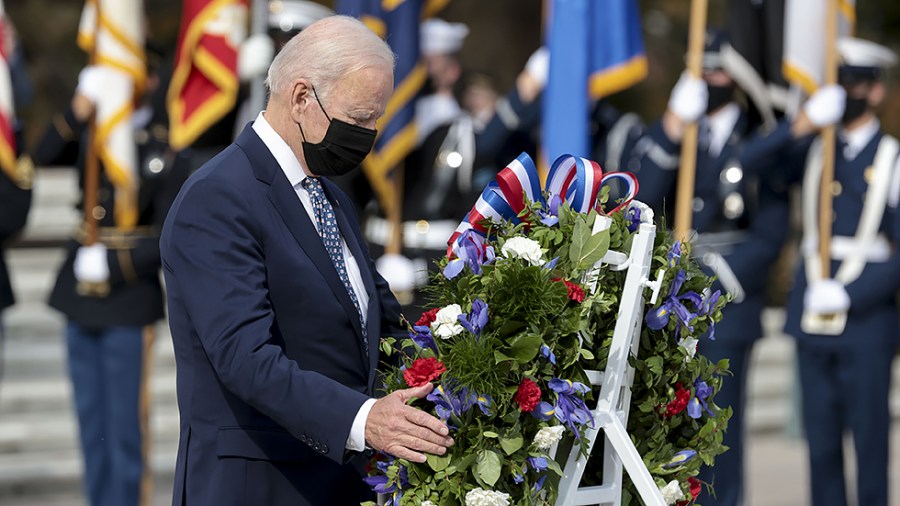 President Biden participates in a wreath-laying ceremony on the 100th anniversary of the Tomb of the Unknown Soldier at Arlington National Cemetery in Arlington, Va., on Veterans Day, Thursday, November 11, 2021.