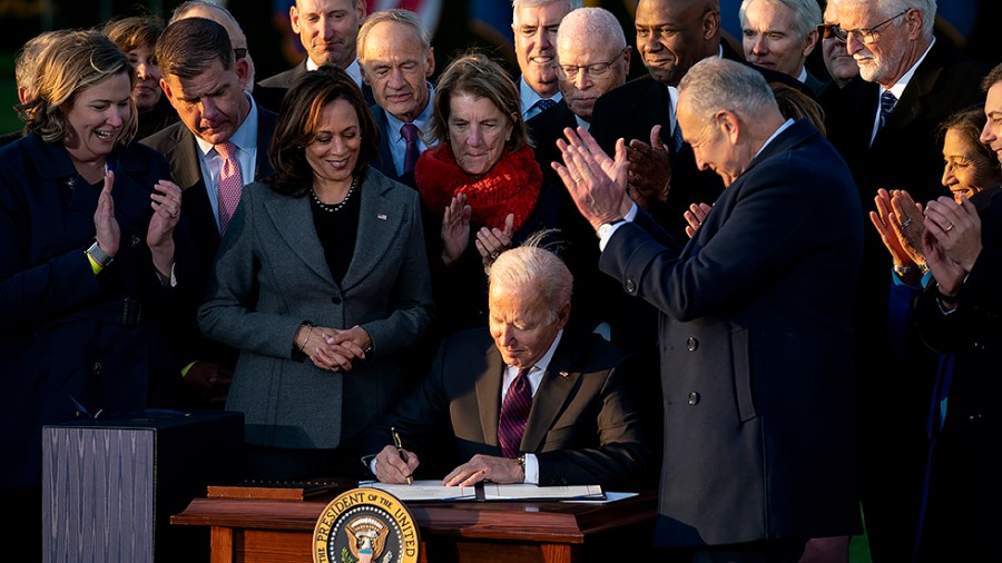 President Biden signs for the Infrastructure Investment and Jobs Act during a ceremony on the South Lawn of the White House on Monday, November 15, 2021.