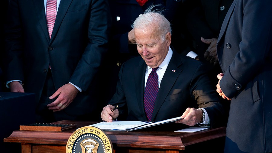 President Biden signs for the Infrastructure Investment and Jobs Act during a ceremony on the South Lawn of the White House on Monday, November 15, 2021.