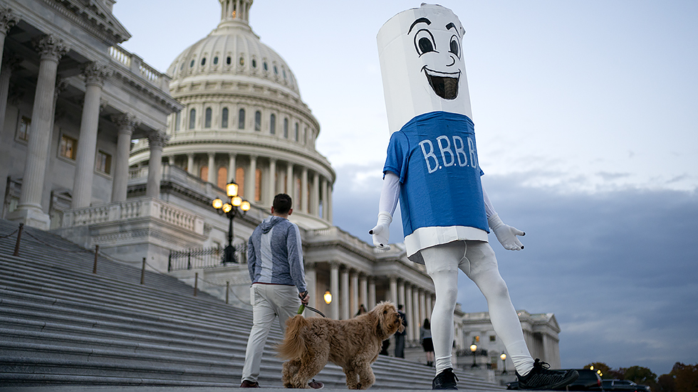 A Build Back Better Act mascot from a non-profit group poses outside the House Chamber on Thursday, November 18, 2021.