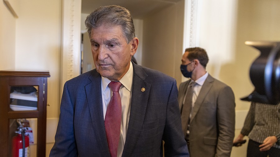 Sen. Joe Manchin (D-W.Va.) leaves a press conference to discuss his view on the bipartisan infrastructure deal on Monday, November 1, 2021.