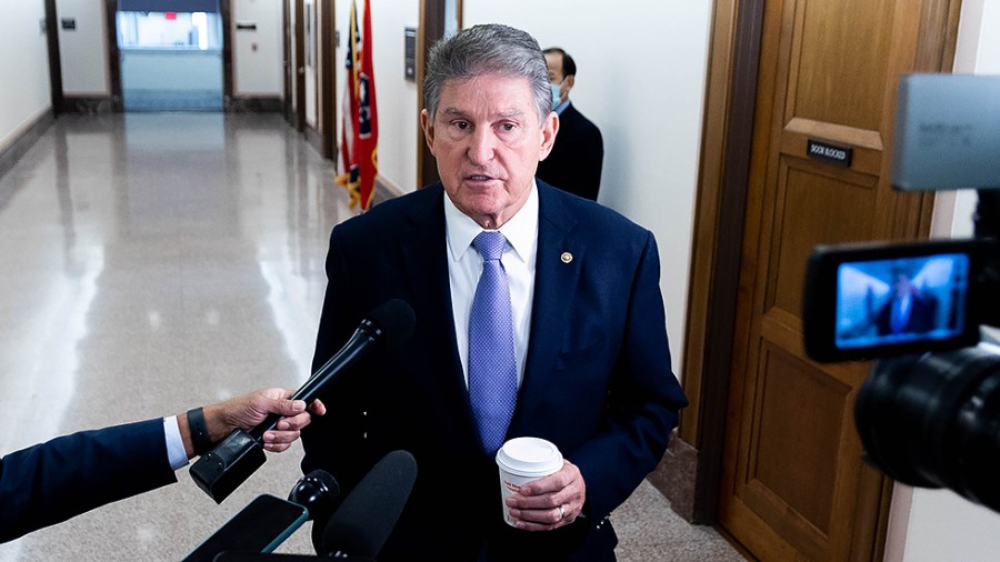 Sen. Joe Manchin (D-W.Va.) speaks to reporters prior to a Senate Energy and Natural Resources Committee hearing on Tuesday, Nov. 16, 2021.