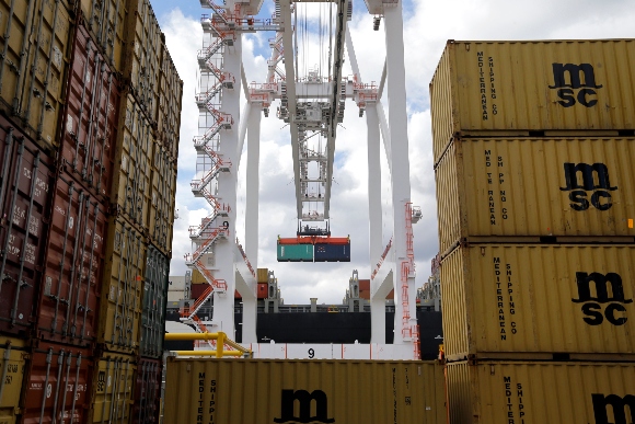 A crane removes a container from a ship at the Port of Baltimore's Seagirt Marine Terminal