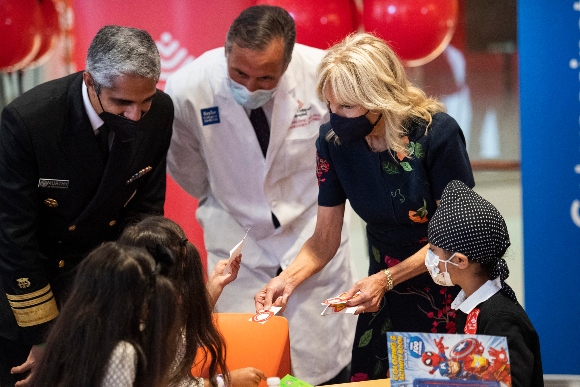 U.S. Surgeon General Vivek Murphy, Dr. Jim Versalovic and first lady Jill Biden visit with kids before they receive their COVID-19 vaccines