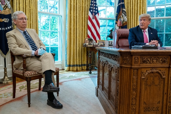 Senate Majority Leader Mitch McConnell of Ky., listens as President Donald Trump speaks