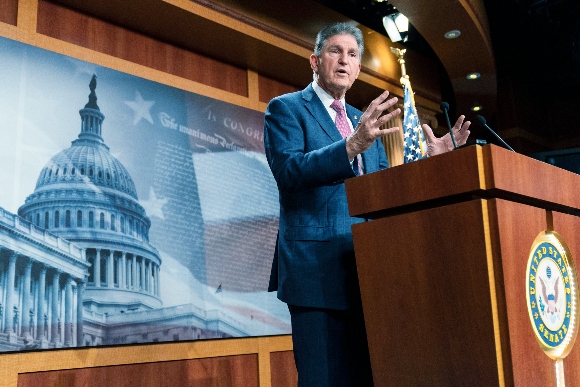 Sen. Joe Manchin, D-W.Va., speaks with reporters during a news conference