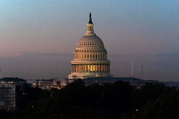 The U.S. Capitol is seen on a sunrise in Washington