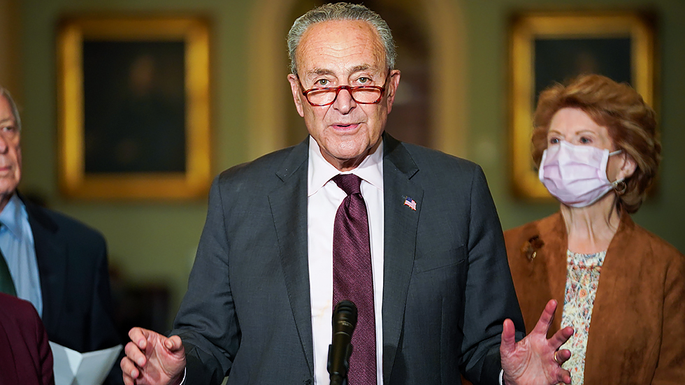 Majority Leader Charles Schumer (D-N.Y.) addresses reporters after the weekly policy luncheon on Tuesday, October 19, 2021.