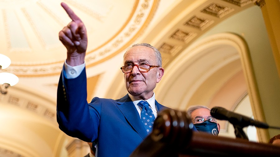 Majority Leader Charles Schumer (D-N.Y.) points to a reporter after the weekly policy luncheon on Tuesday, November 16, 2021.