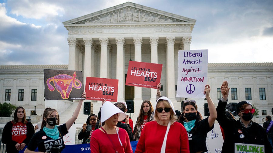 People demonstrate outside the Supreme Court in Washington, D.C., on Monday, November 11, 2021 as the court hears oral arguments for Whole Woman’s Health v. Jackson and United States v. Texas regarding the Texas abortion laws.